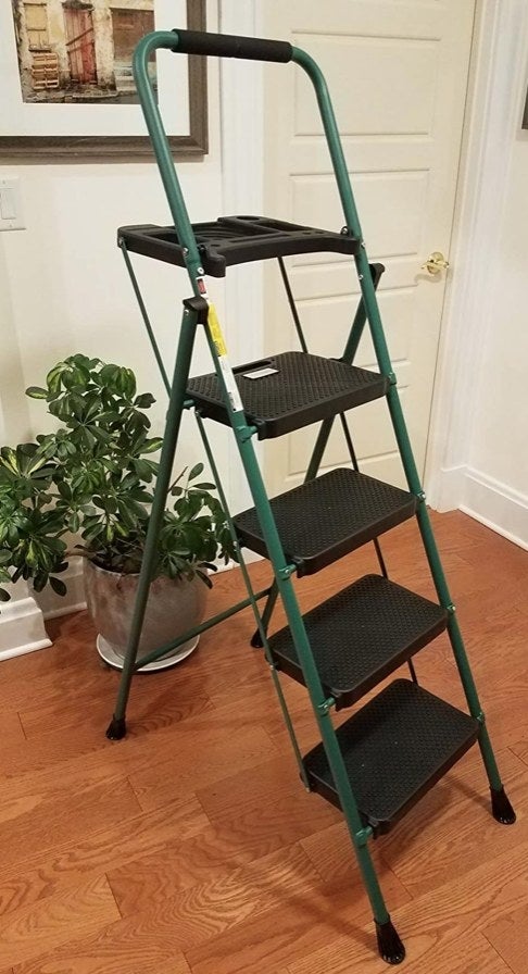 A small step ladder in a reviewer&#x27;s home with green legs