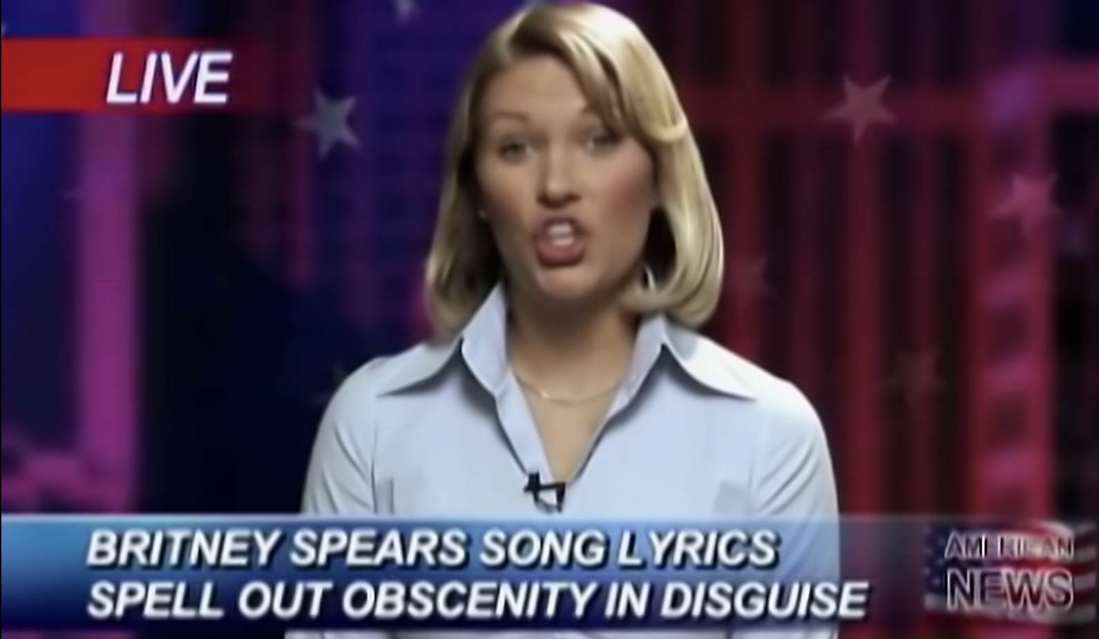 fake news reporter with the footer &quot;Britney Spears song lyrics spell out obscenity in disguise&quot; in the music video for the song