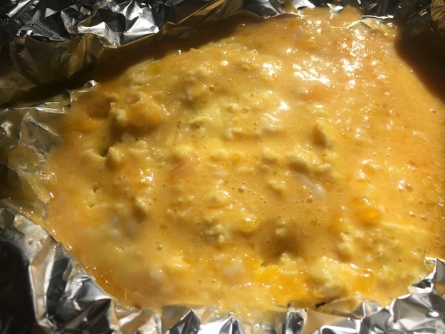 An undercooked omelette in tin foil