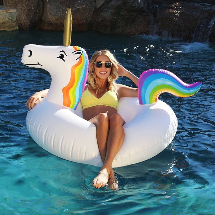 A person sitting on the unicorn float