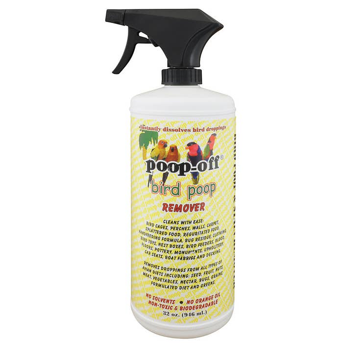 A yellow spray bottle with bird poop remover in it