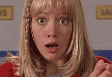 Lizzie McGuire looking shocked and covering her mouth