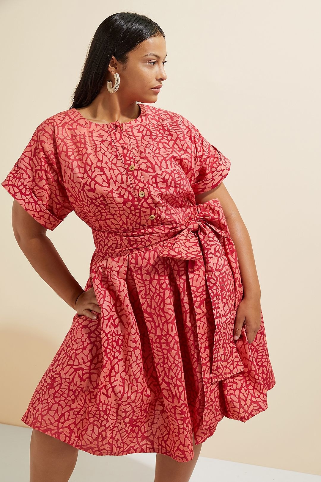 model wearing the pink patterned dress with a large skirt