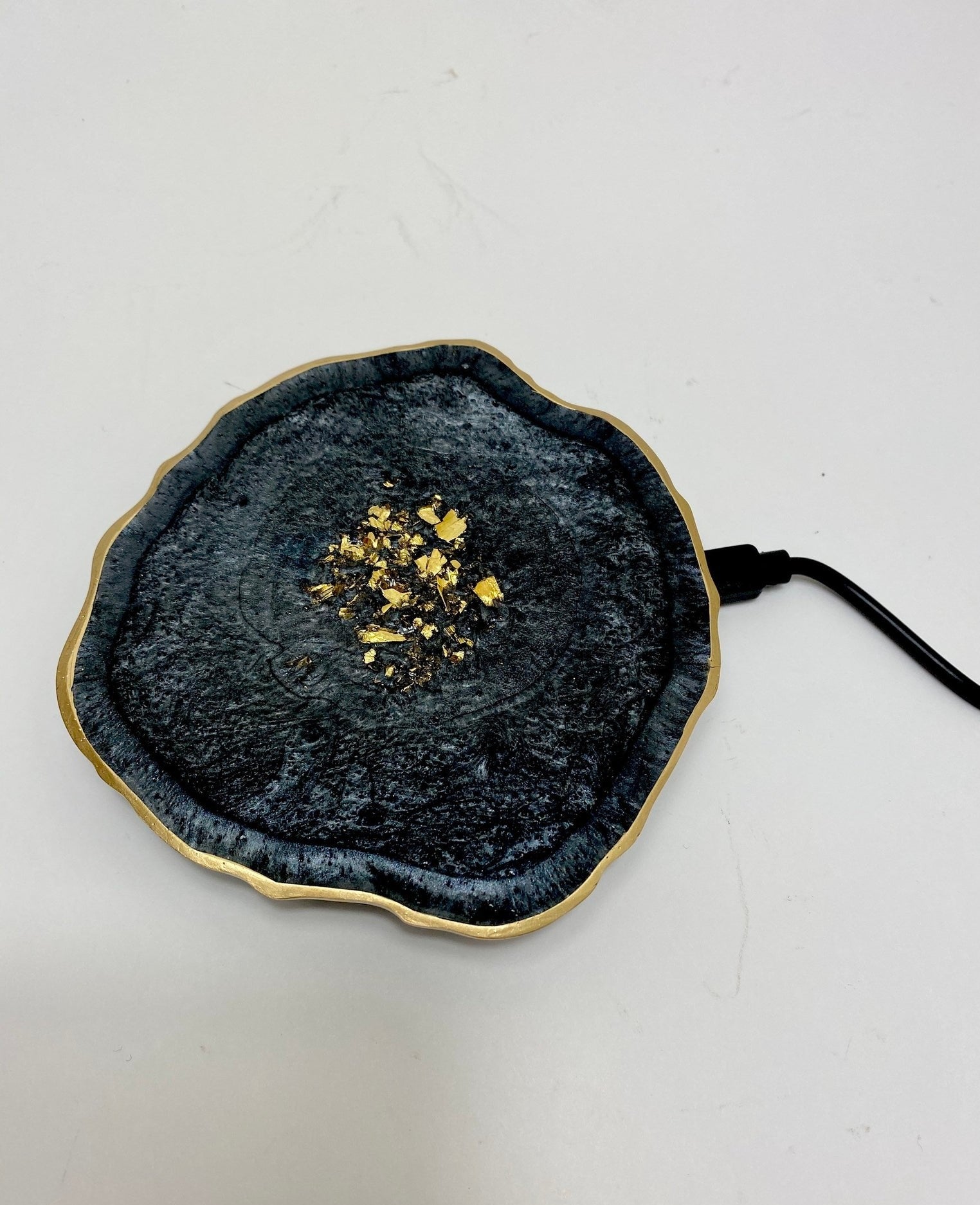 a black resin geode wireless charger