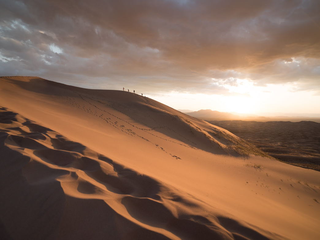 A giant dune in desert at twilight. 