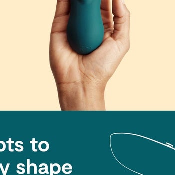 Model holding green external vibrator to display bottom detail
