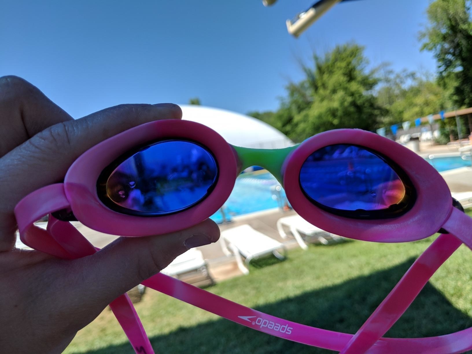 A reviewer demonstrates the tint on the pink goggles