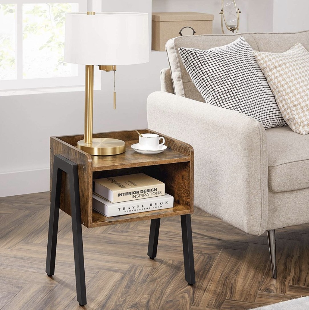 the wood and metal table being used in a living room