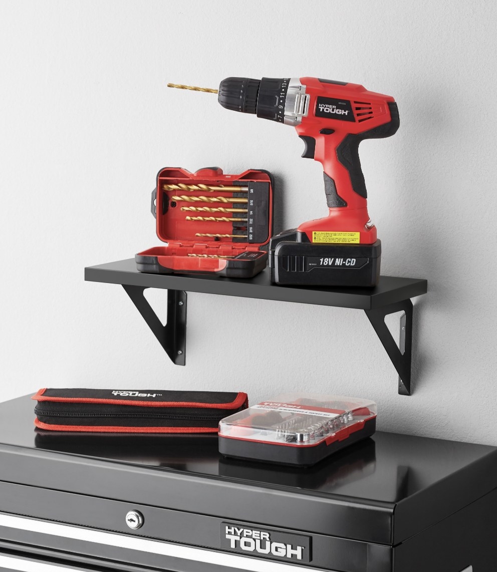 the shelf in a garage holding a drill
