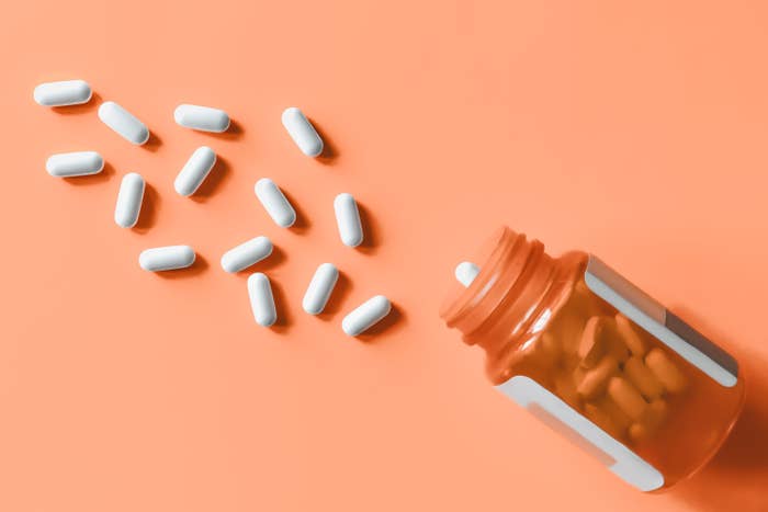An image of pharmaceutical pills on an orange background