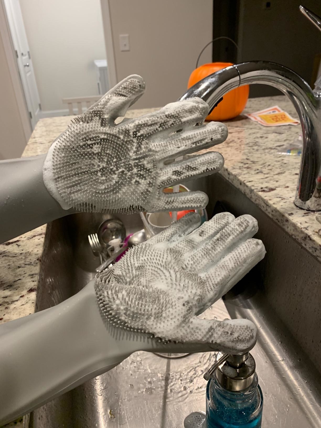 Reviewer gloves with soap on them
