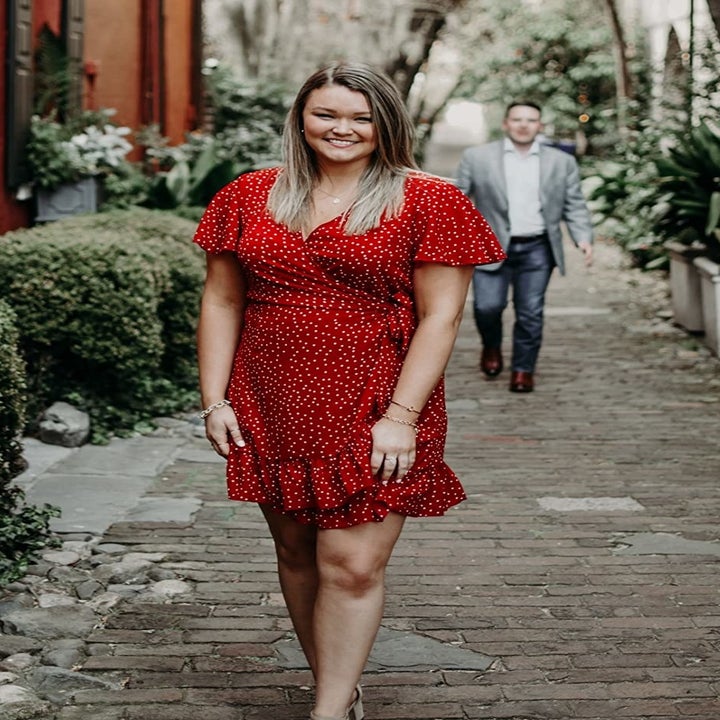 reviewer wearing the polka dot dress in red