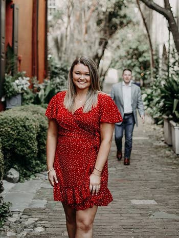 reviewer wearing the polka dot dress in red