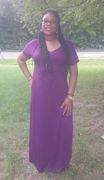 reviewer wearing the dress in purple