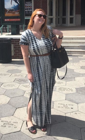 reviewer wearing the maxi dress in blue tie-dye with a belt