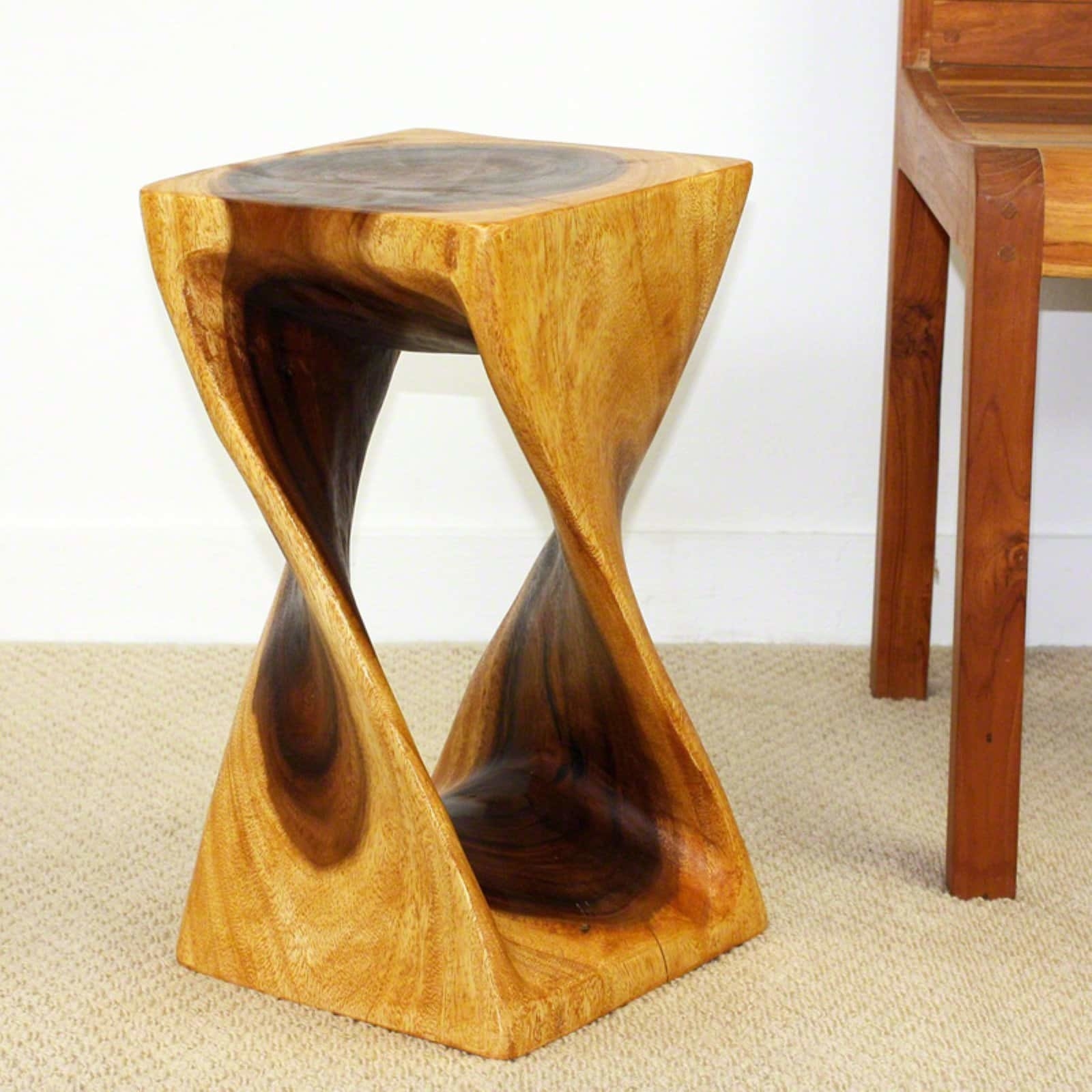 a wooden twisted stool