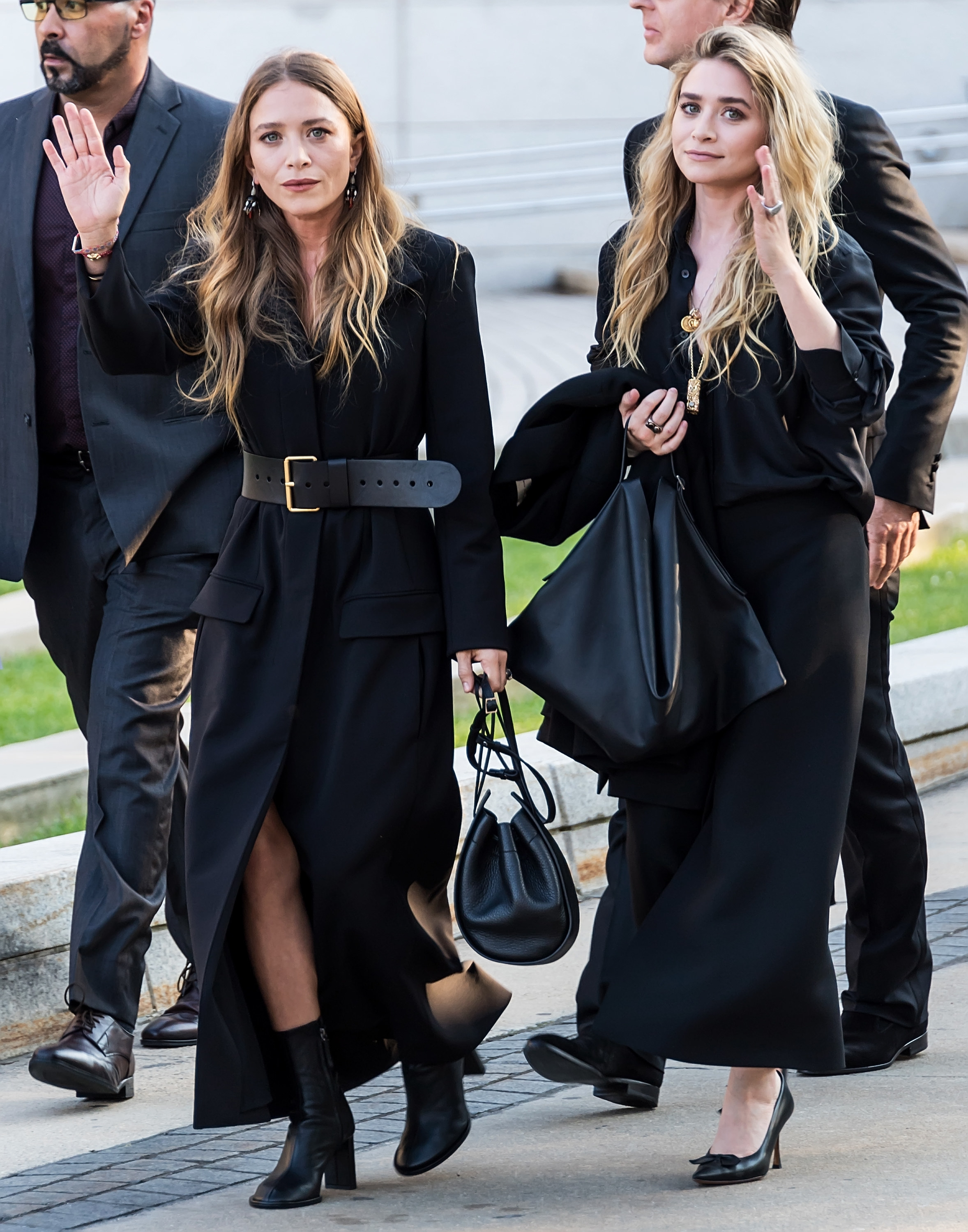 Mary-Kate, in a black coat, and Ashley, in a black dress, arrive at the CFDA Fashion Awards in 2018