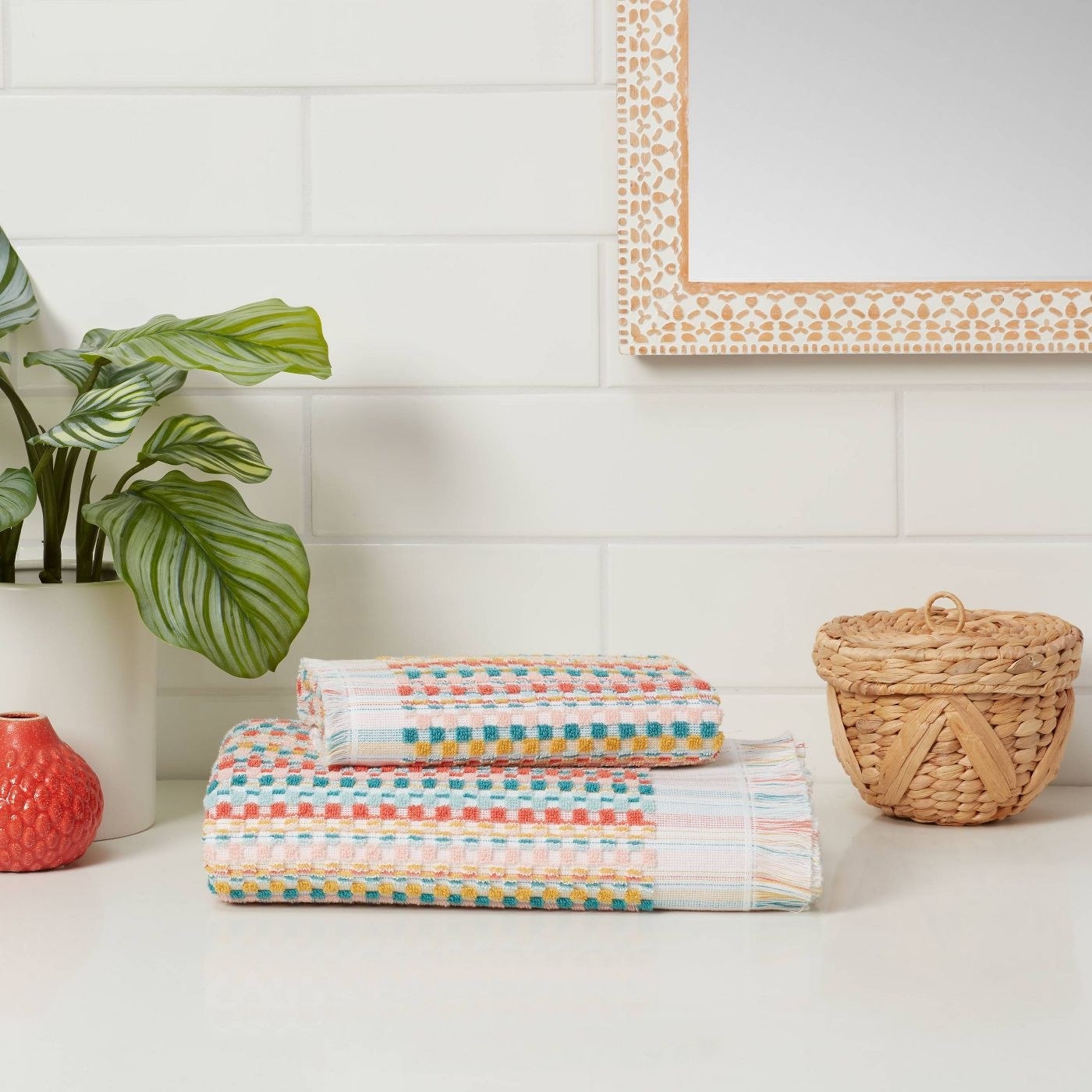 The multicolored checker-patterned towels on a counter