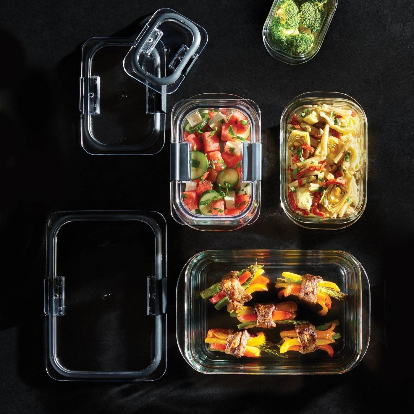 overhead shot of different sized glass food storage containers with food inside