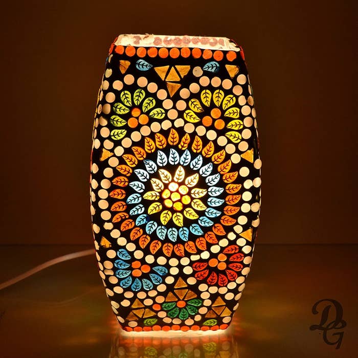 A Turkish mosaic lamp with floral patterns on it 