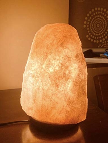 A Himalayan Rock Salt lamp on a table 