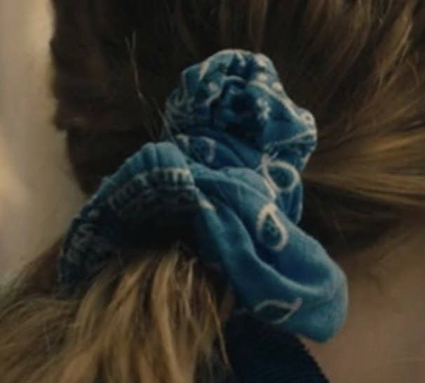 A blue, bandana print hair scrunchie