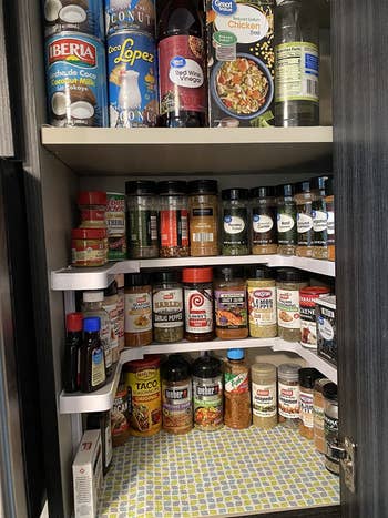 Reviewer's organized cabinet after using spice shelf
