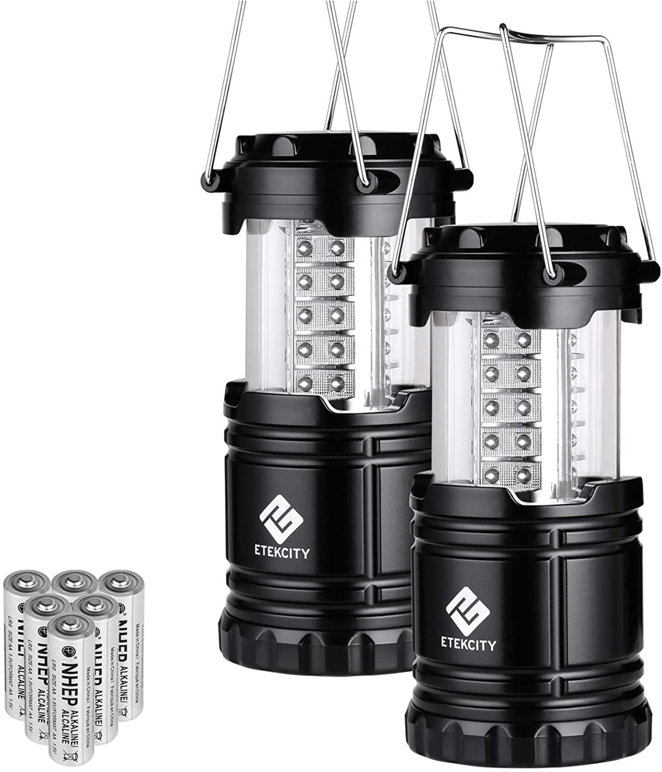 Two of the Etekcity Lanterns with a pack of batteries next to them