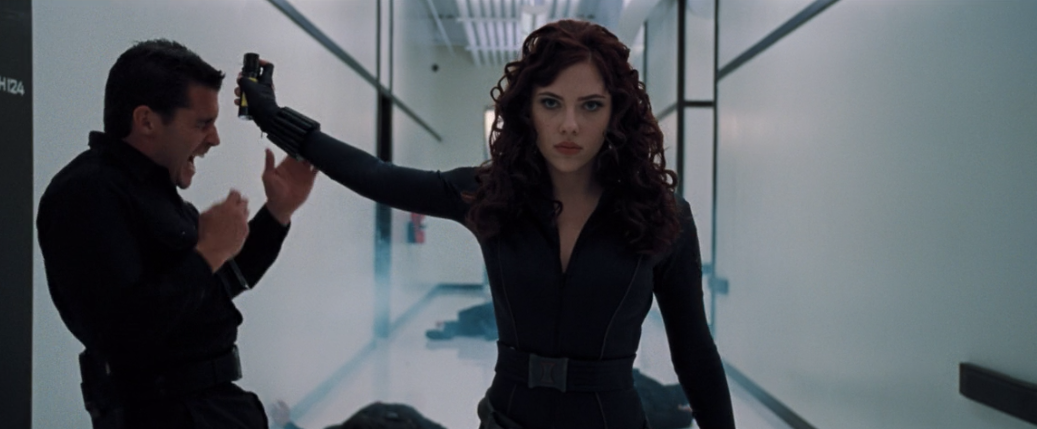 Natasha Romanoff sprays mace into the face of a bad guy who was trying to grab her.