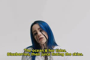 billie eilish with blue hair and black tears falling from her eyes