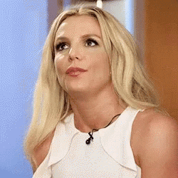 Britney Spears tilts her head up, widens her eyes, and mouths, &quot;Whoa&quot;