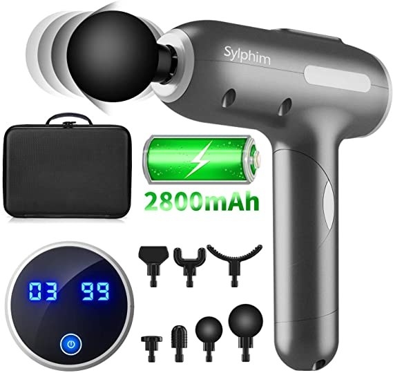 The massage gun with the included accessories