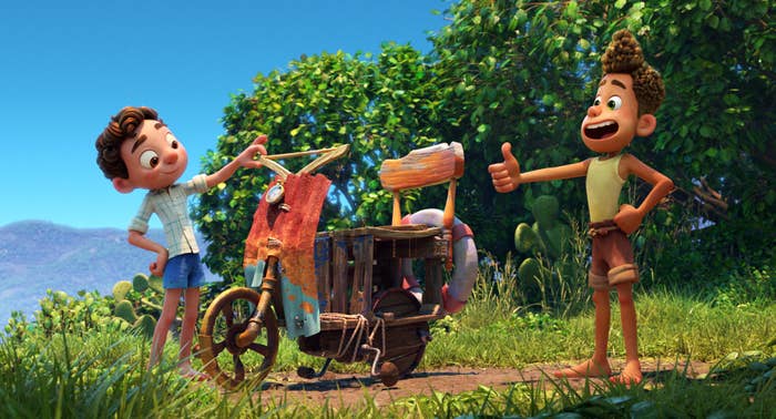 An image from the movie with Luca and Alberto admiring a janky scooter they built