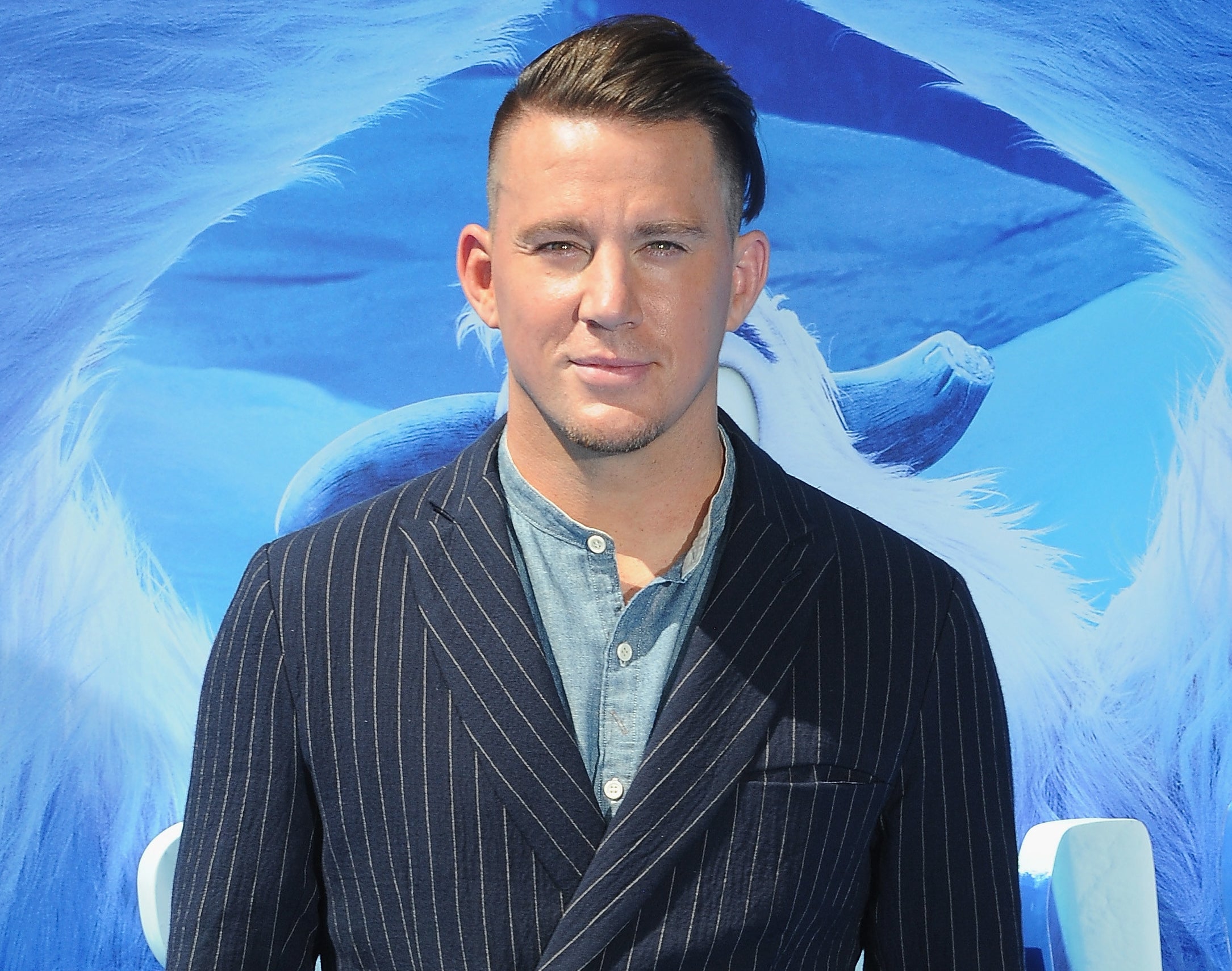 Channing wears a navy striped suit to an event