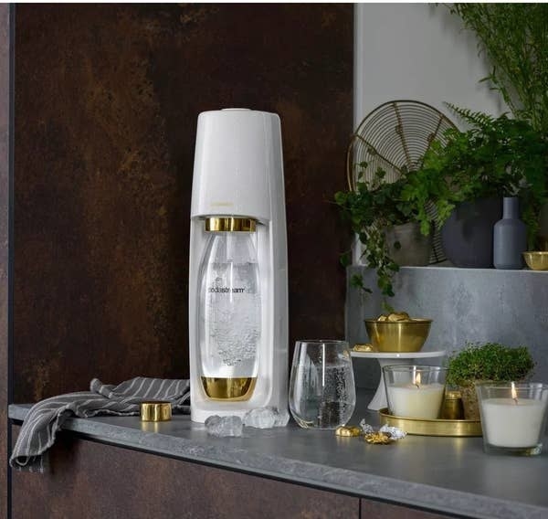 the white and gold sodastream on a decorated counter