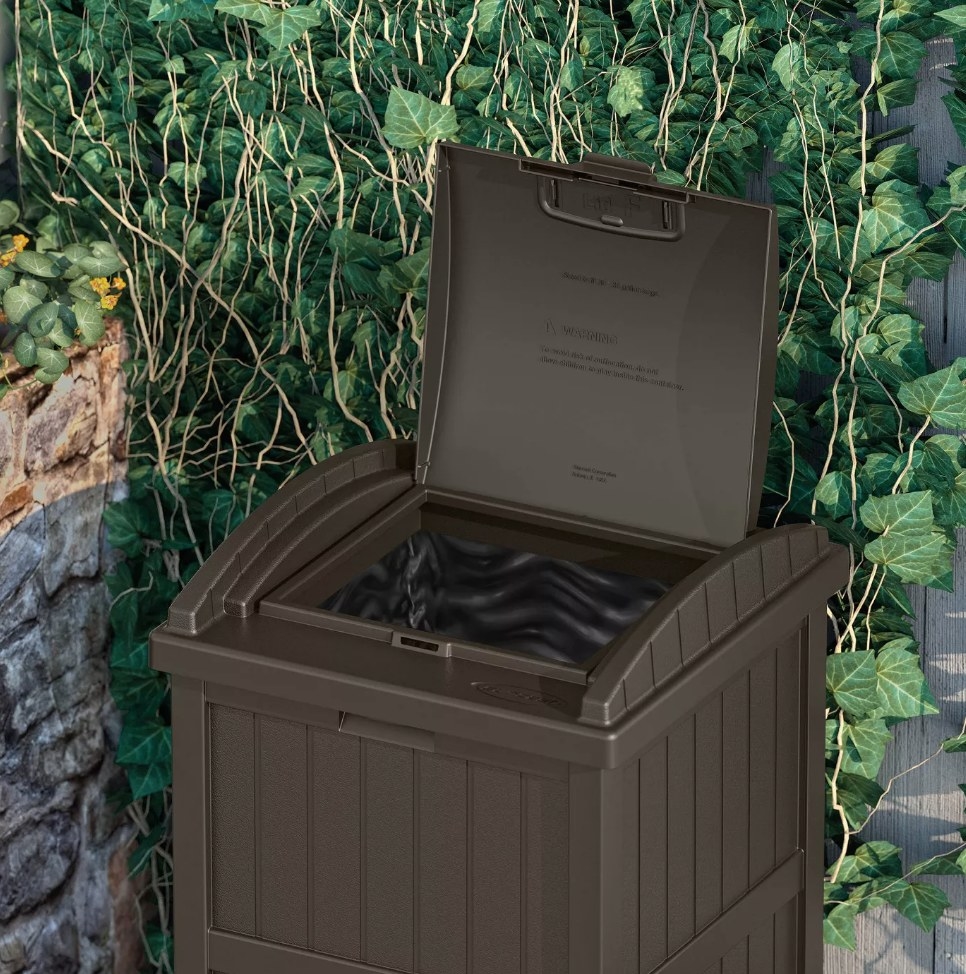 Brown outdoor waste bid with hide away lid opened up 