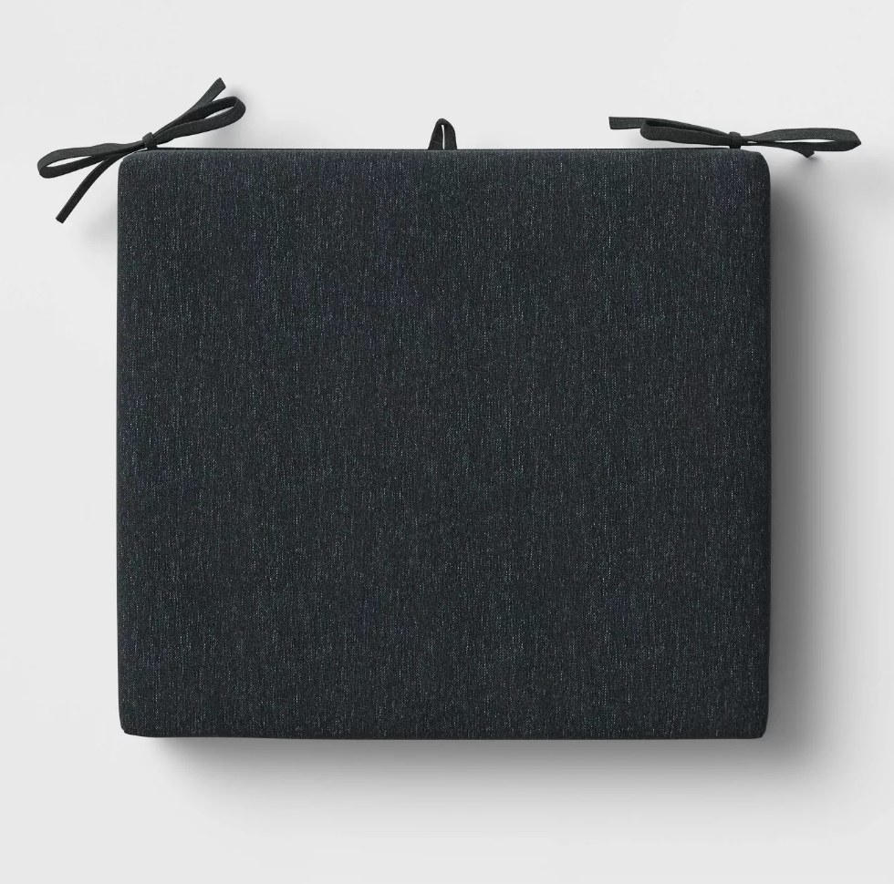 A square charcoal cushion with ties