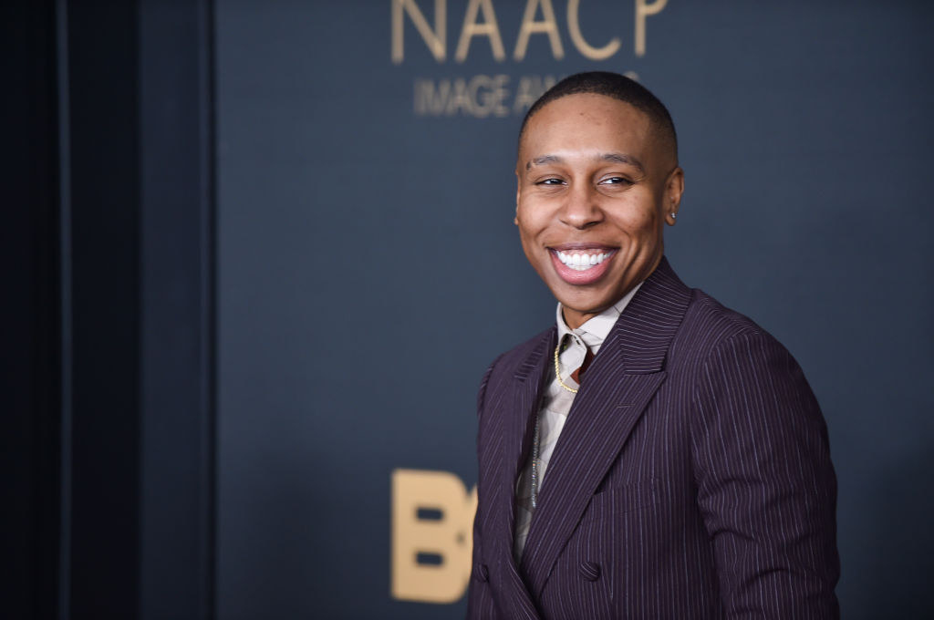 Waithe smiling in a pinstriped suit outside the NAACP Image Awards