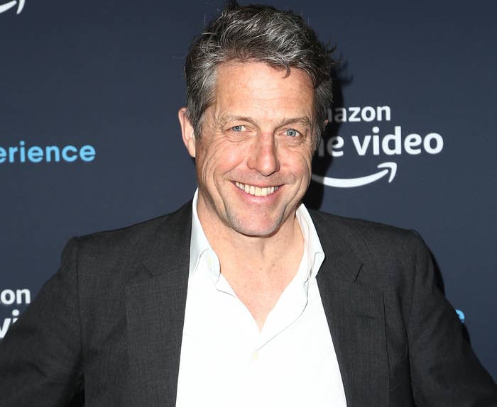 Hugh smiles while attending a recent event