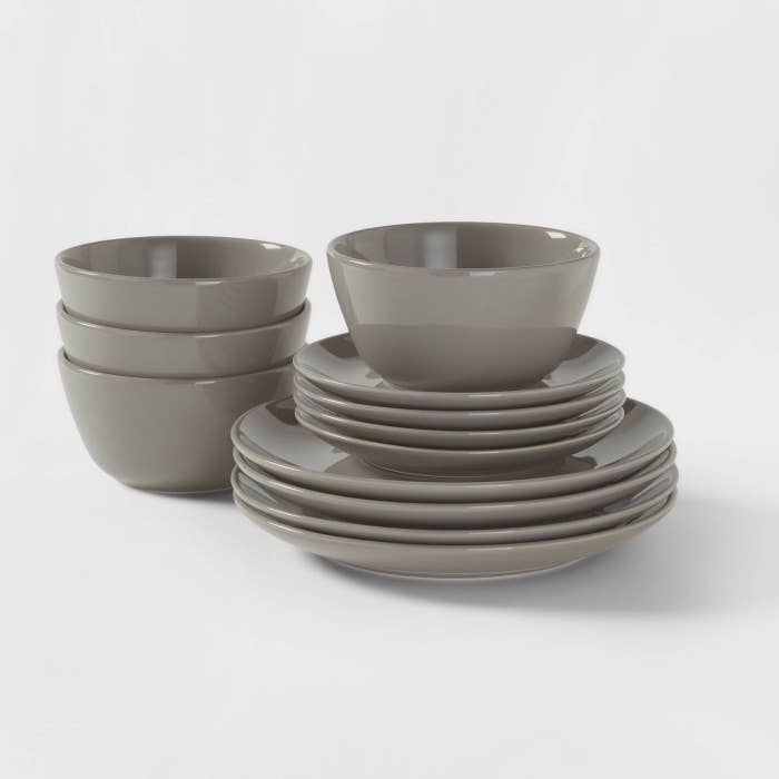 stacks of gray plates and bowls