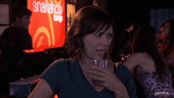 Rashida Jones&#x27; character on parks and rec drunkenly trying to get a drink straw in her mouth