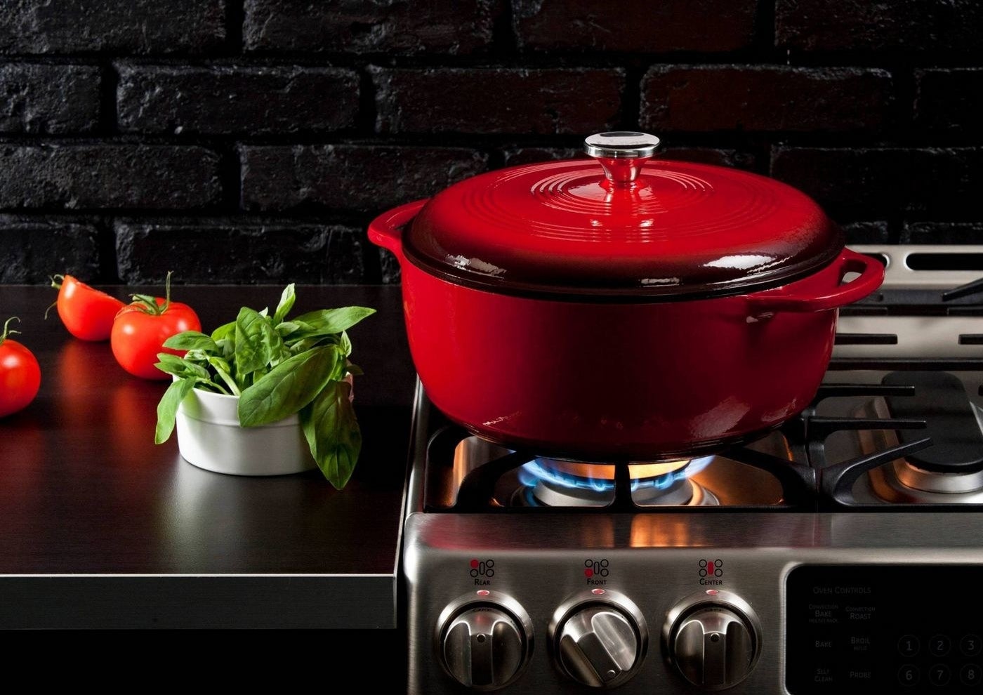 the red dutch oven on a stove