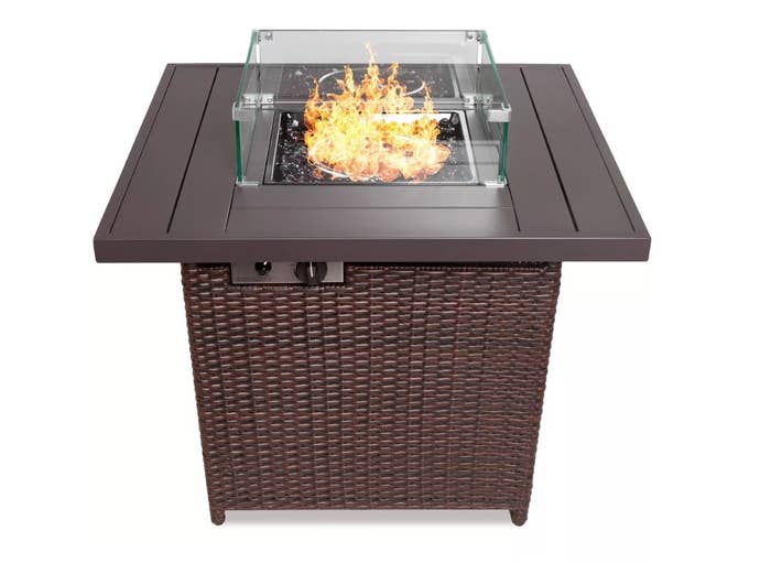 Brown wicker fire pit with square top and glass cover 