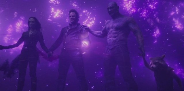 Groot, Gamora, Star-Lord, Drax, and Rocket all hold hands to disperse the energy of the powerful Power Stone.