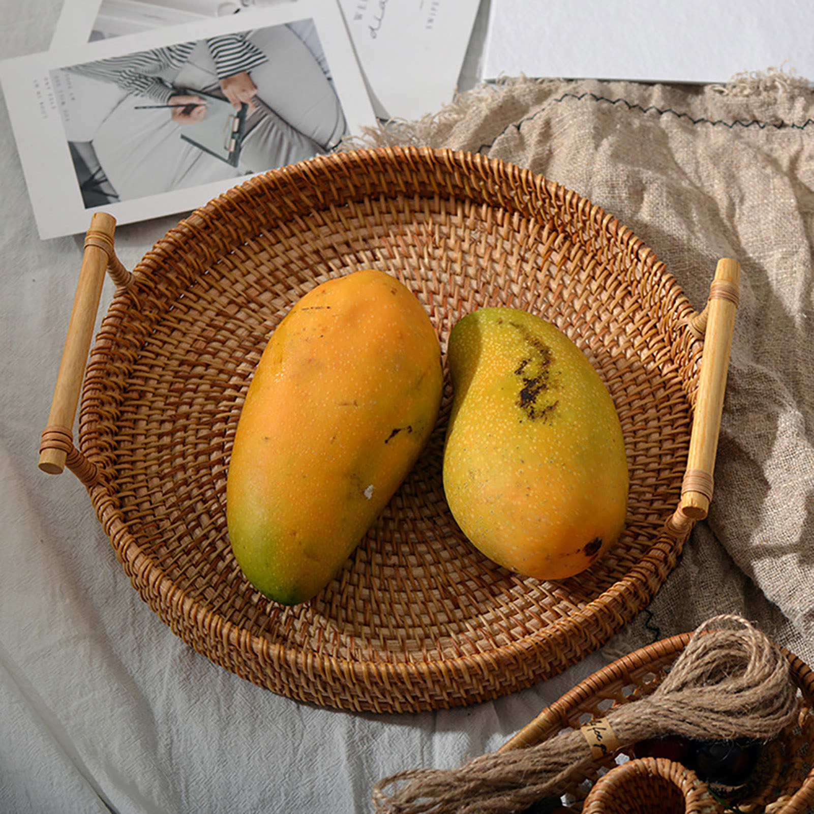 wicker tray with mangos in it 