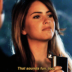 Malia drinks out of a flask and bouncing to a beat of music that cannot be heard.