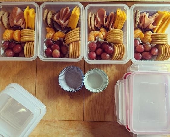 The reviewer&#x27;s photo of the pack of 12 food storage containers holding meals