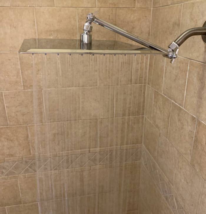 reviewer photo showing their rain showerhead turned on