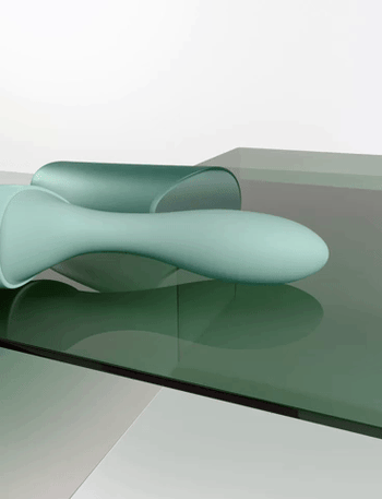 Green vibrator with beaded stroking mechanism in motion