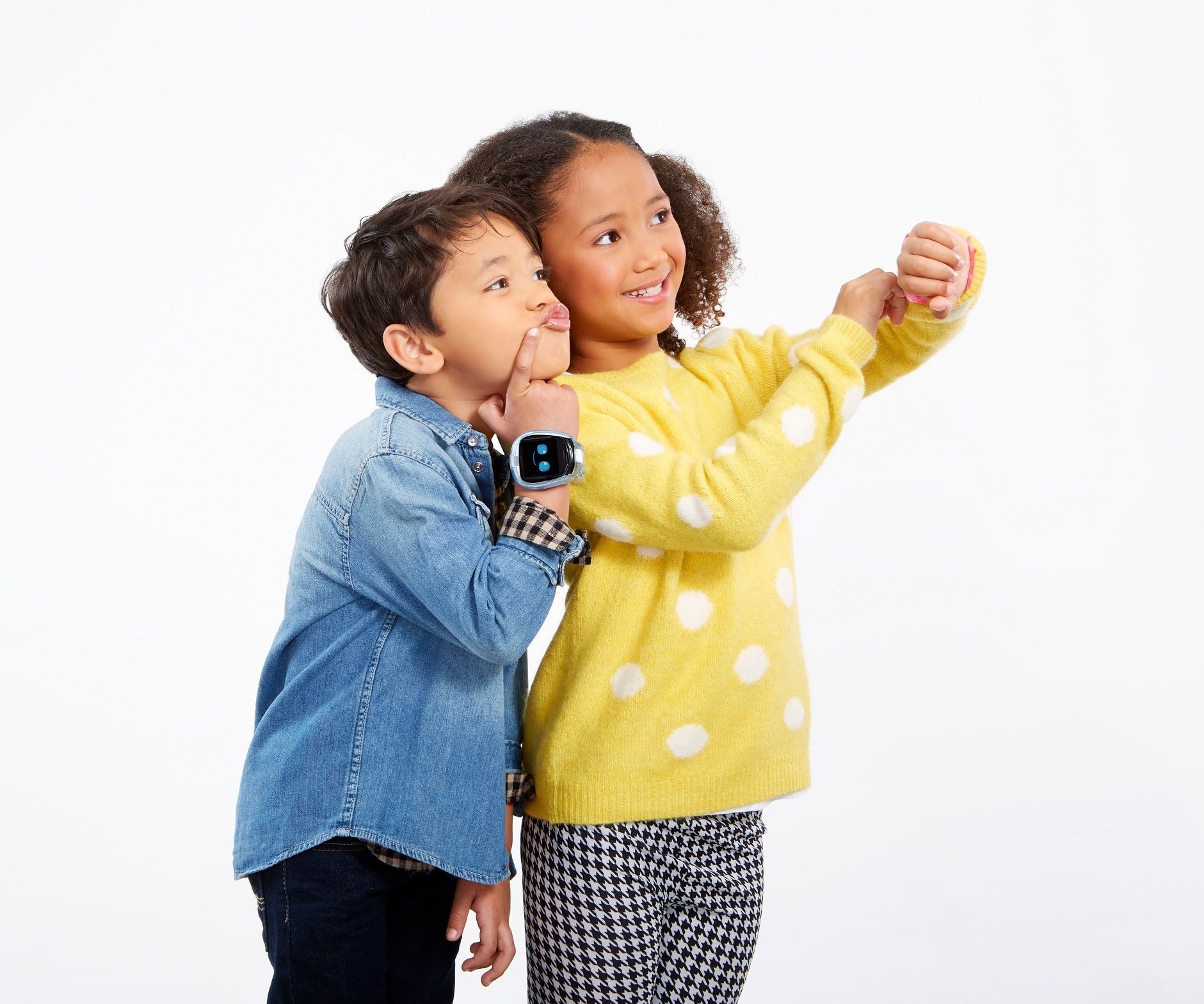 two kids wearing the watch and taking a selfie